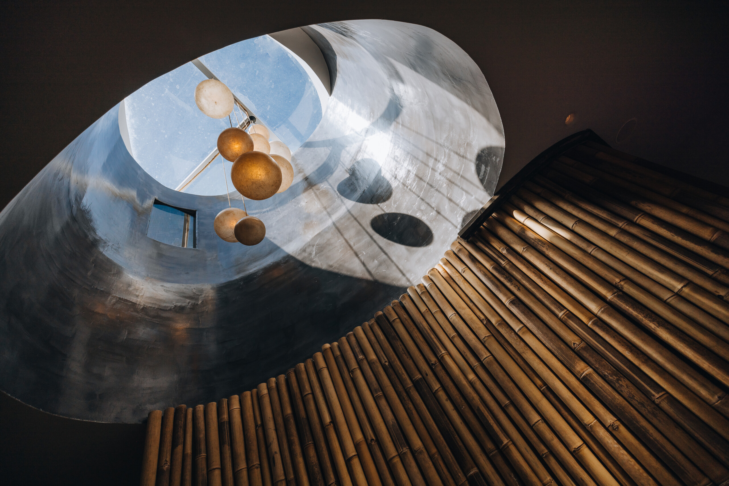 Round elements hanging of the glass ceiling in Kallos Spa, Andronis Concept Wellness Resort in Santorini